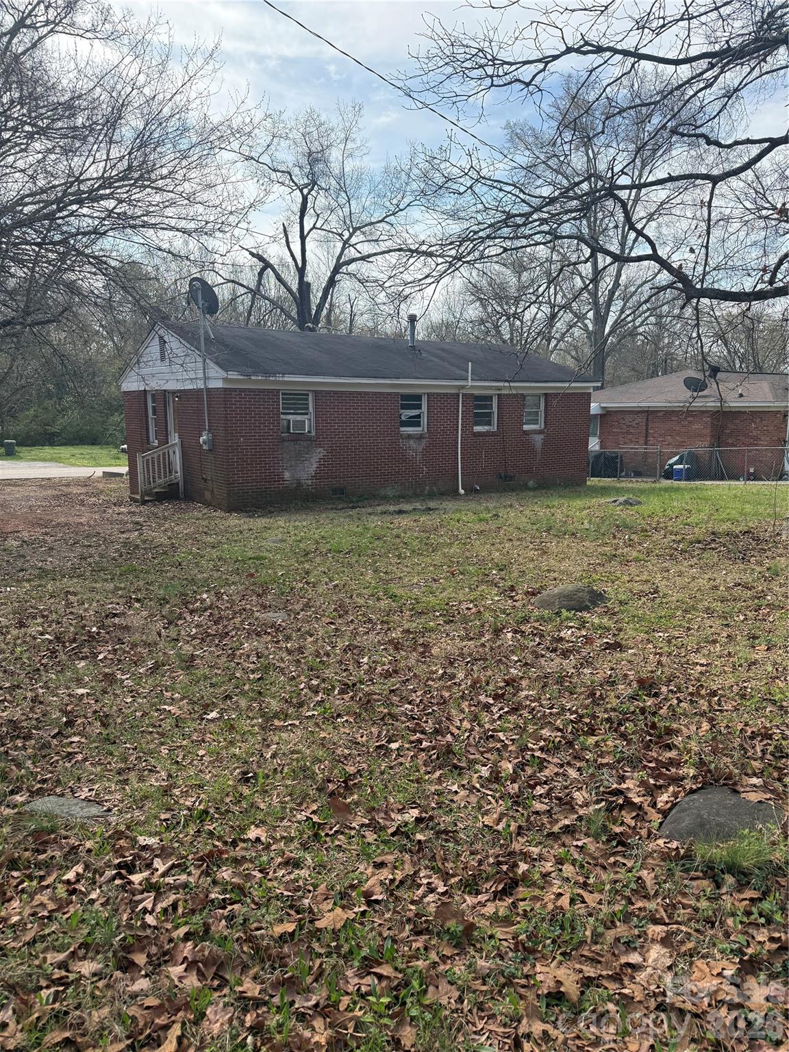 205 Jewel Street Chester, SC 29706 - Photo 17 of 20 a backyard of a house with lots of green space