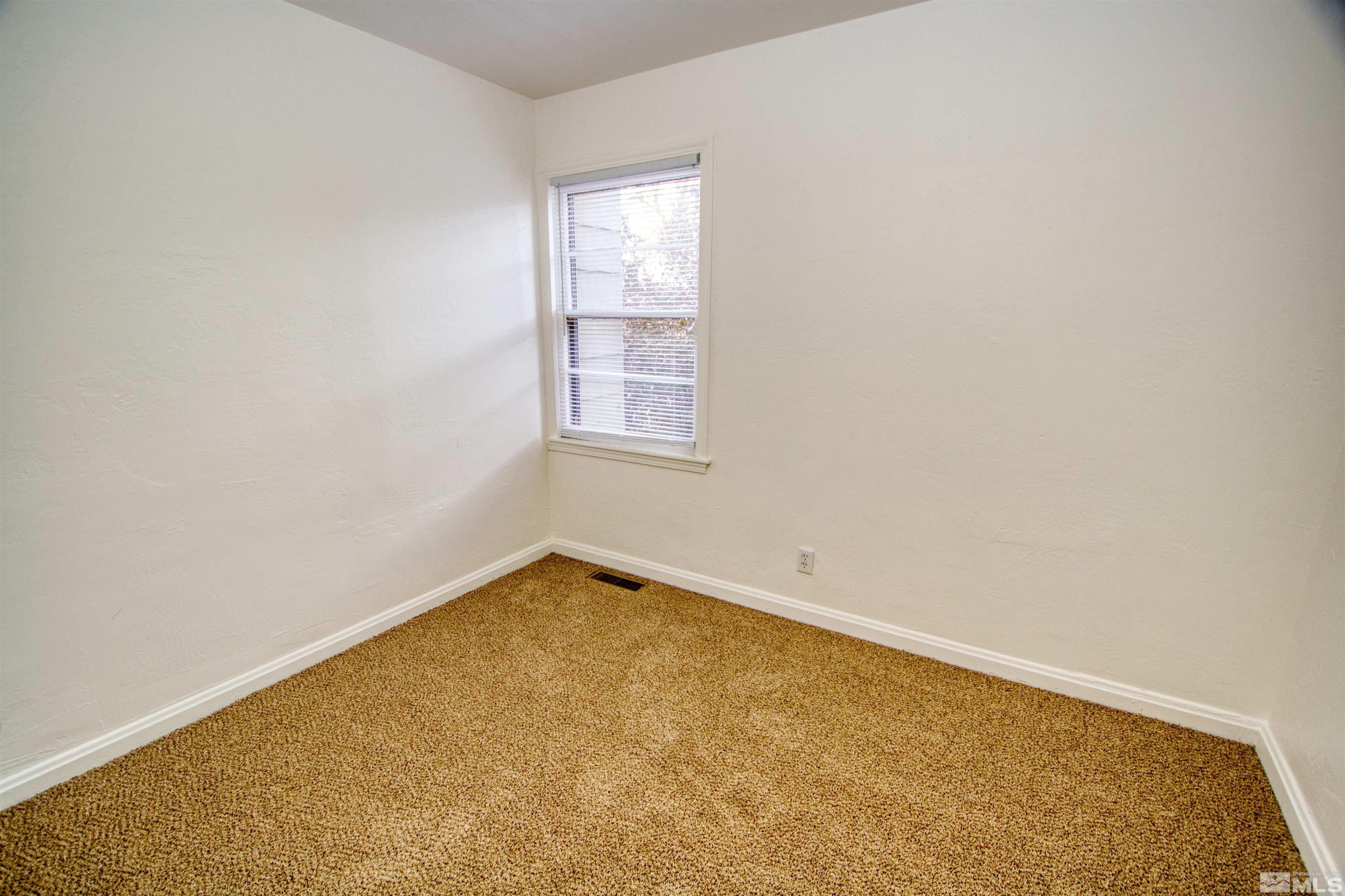 345 H Street Sparks, NV 89431 - Photo 12 of 17 an empty room with a window