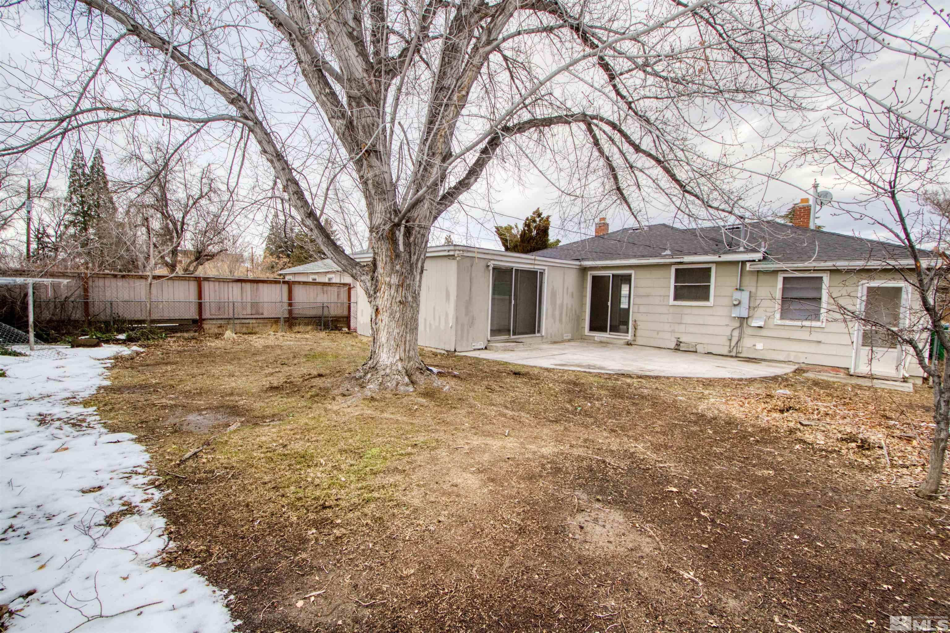 345 H Street Sparks, NV 89431 - Photo 17 of 17 a front view of a house with a yard covered in snow