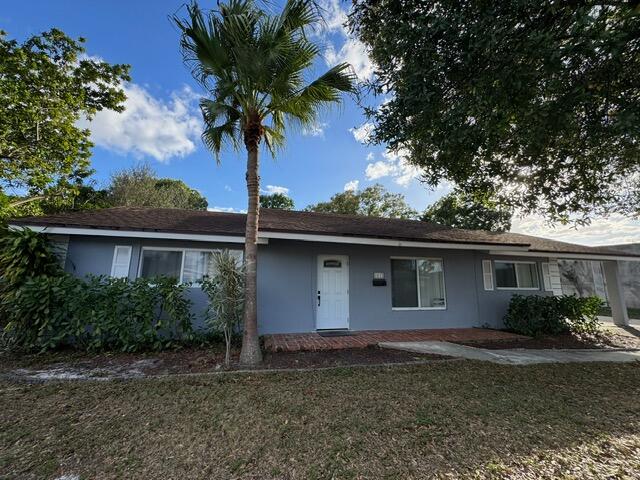 1632 Northwest 5th Street Boca Raton, FL 33486 - Photo 1 of 22 a house with a tree in front of it