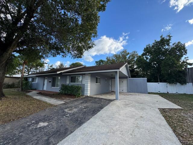 1632 Northwest 5th Street Boca Raton, FL 33486 - Photo 3 of 22 front view of a house with a yard