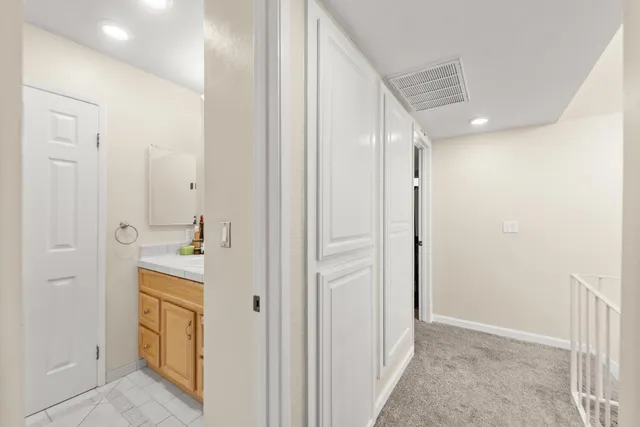 a view of a hallway with closet area