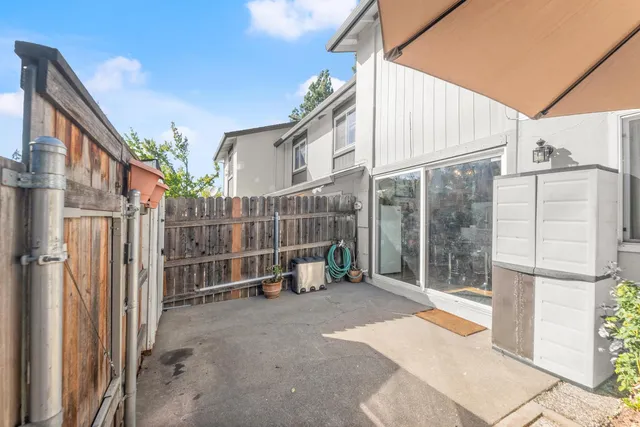 a view of a house with a small yard