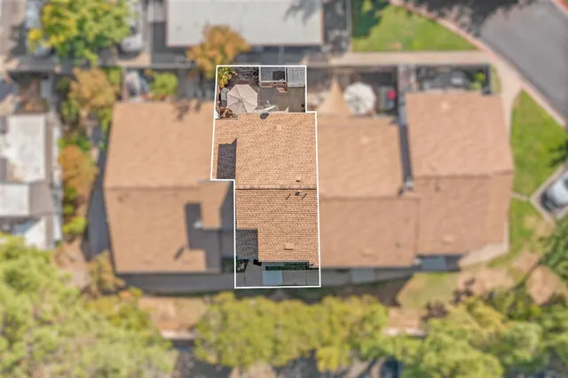 an aerial view of residential building with parking space