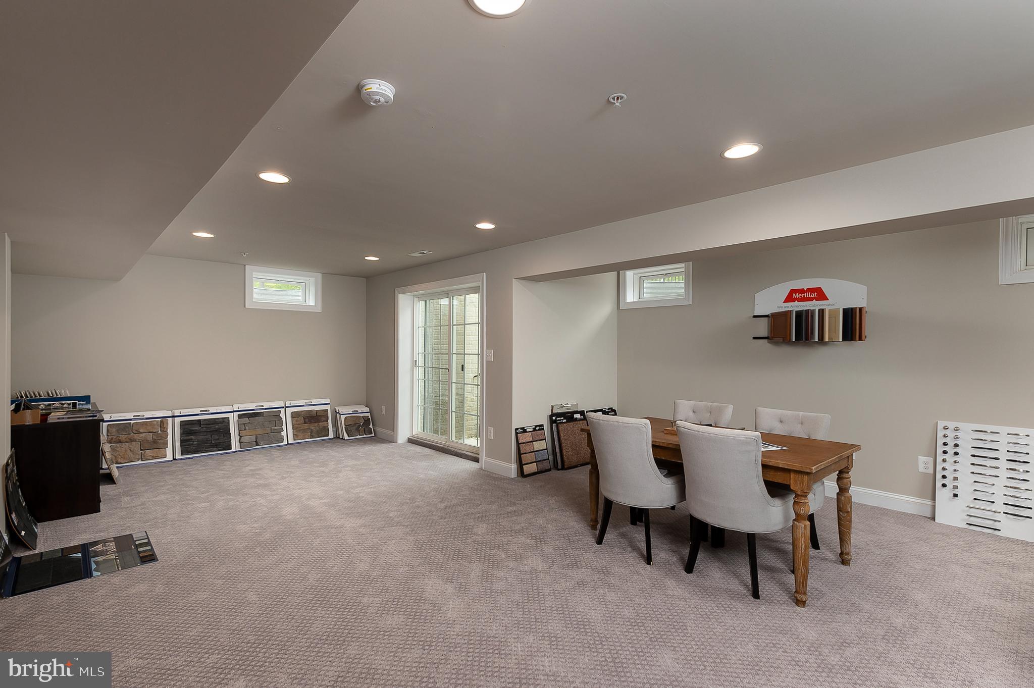 4468 Ilchester Road Ellicott City, MD 21043 - Photo 16 of 32 a dining room with furniture and a flat screen tv