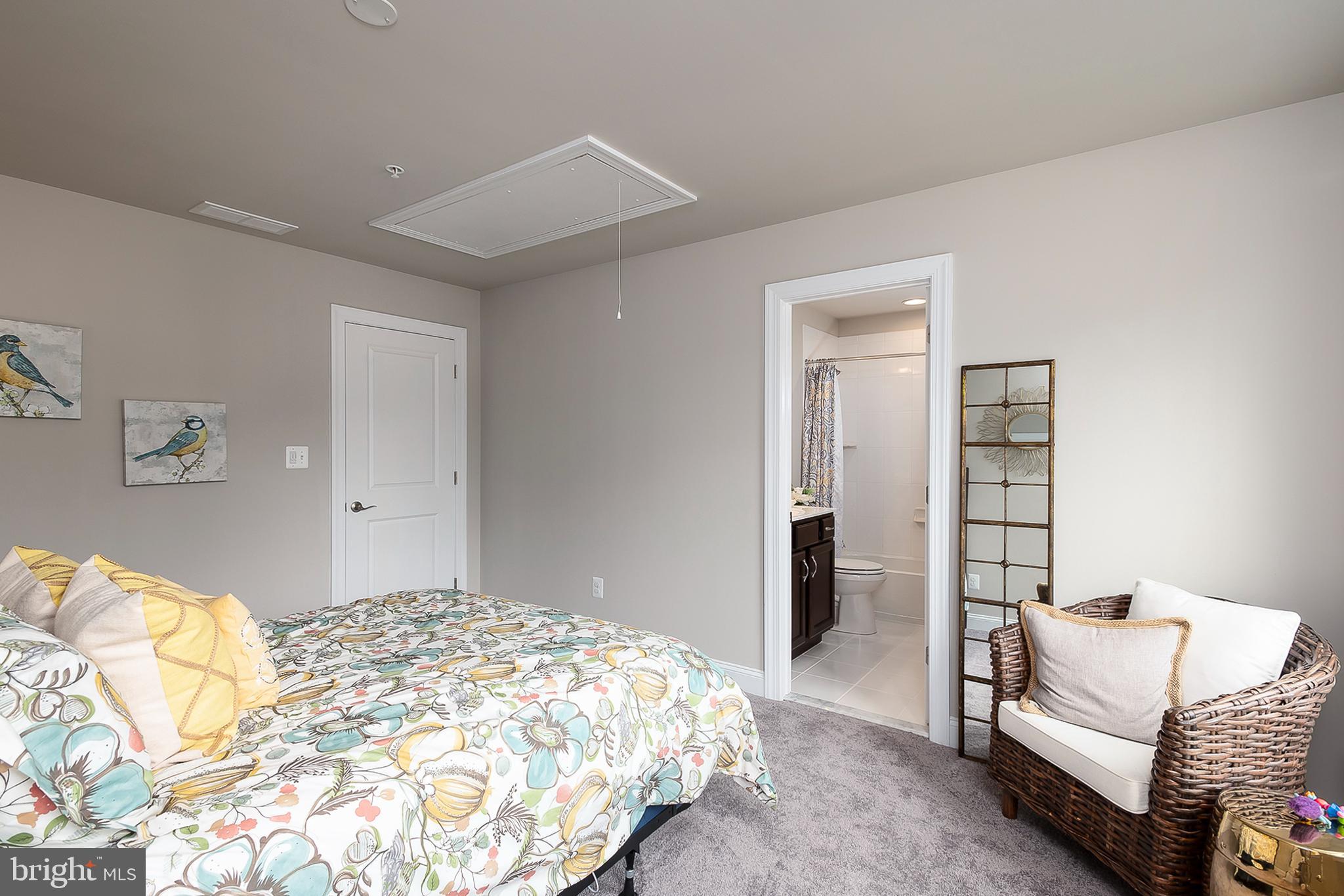 4468 Ilchester Road Ellicott City, MD 21043 - Photo 26 of 32 a bedroom with a bed and a couch