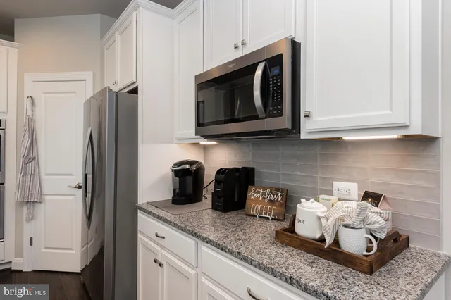 a kitchen with appliances and cabinets