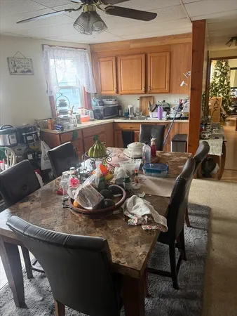 a view of a dining room with furniture window and outside view