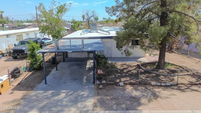 a view of a backyard with sitting area