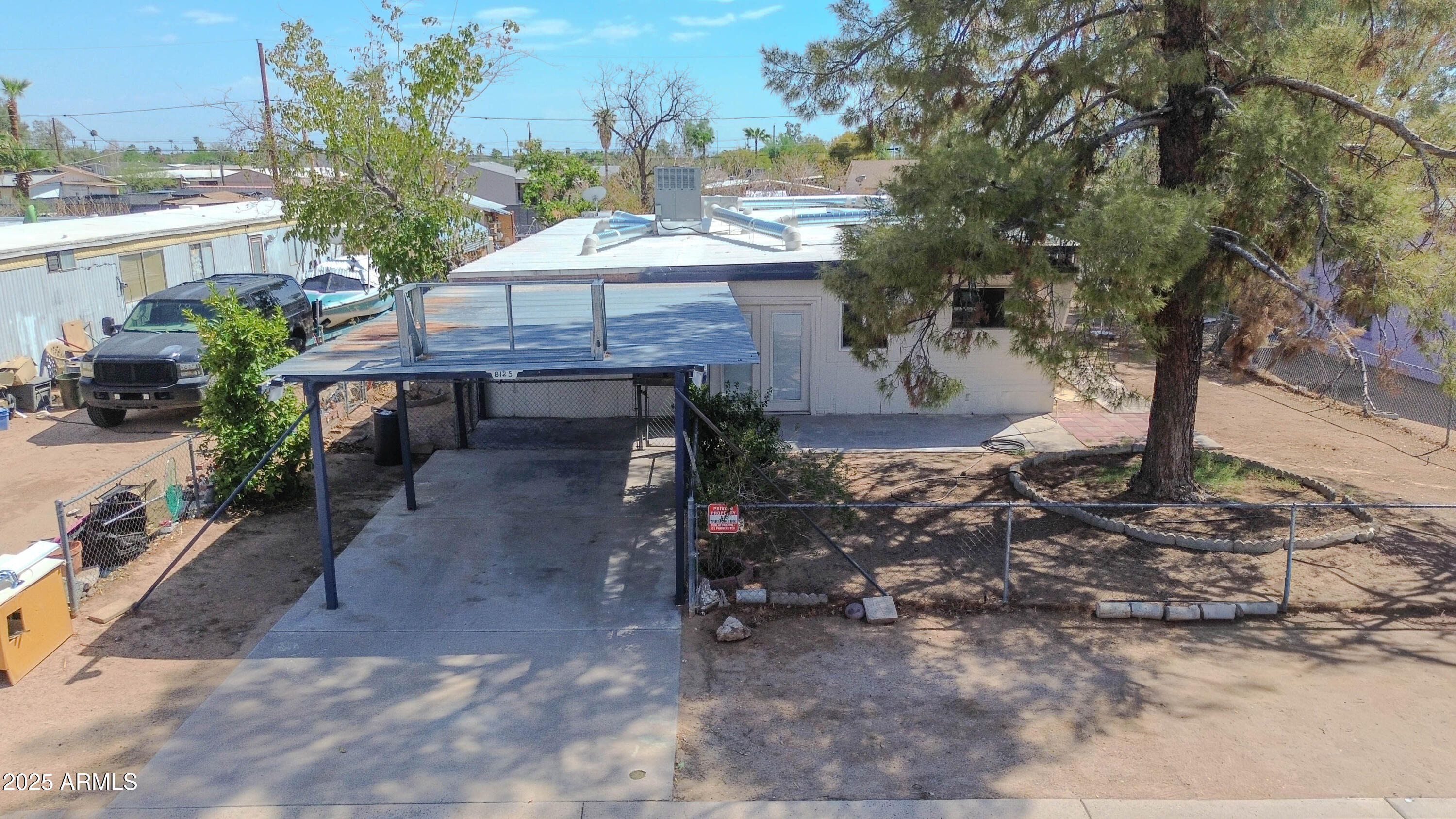 a view of a backyard with sitting area