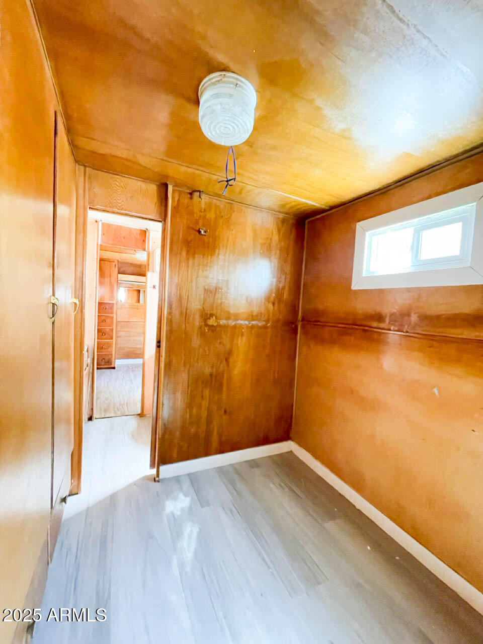 8125 East 5th Avenue Mesa, AZ 85208 - Photo 17 of 46 a view of empty room with wooden floor