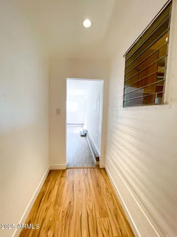 a view of a room with wooden floor and staircase