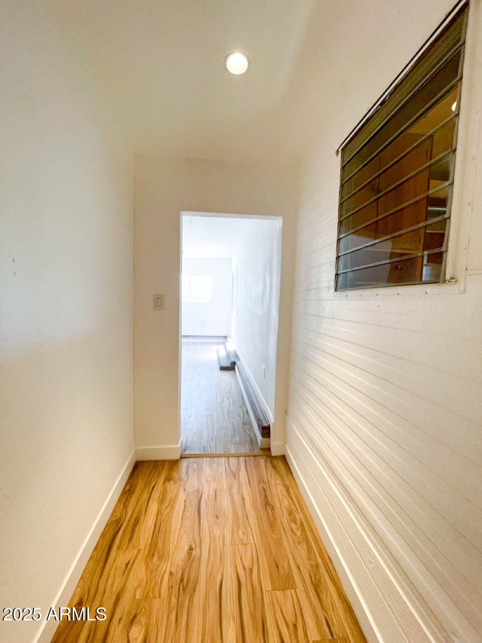 8125 East 5th Avenue Mesa, AZ 85208 - Photo 28 of 46 a view of a room with wooden floor and staircase