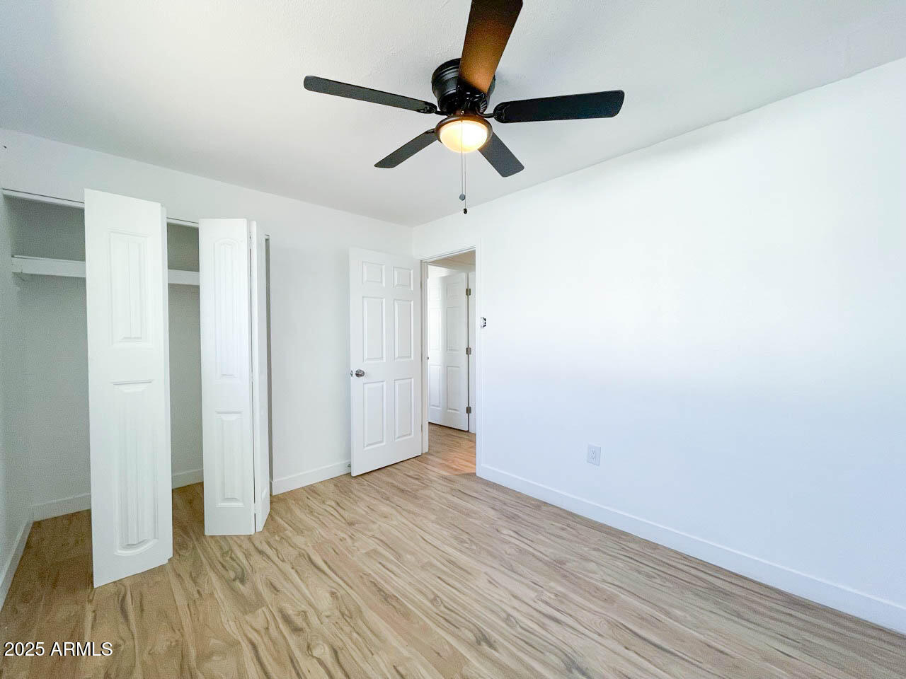 8125 East 5th Avenue Mesa, AZ 85208 - Photo 33 of 46 a view of empty room with wooden floor