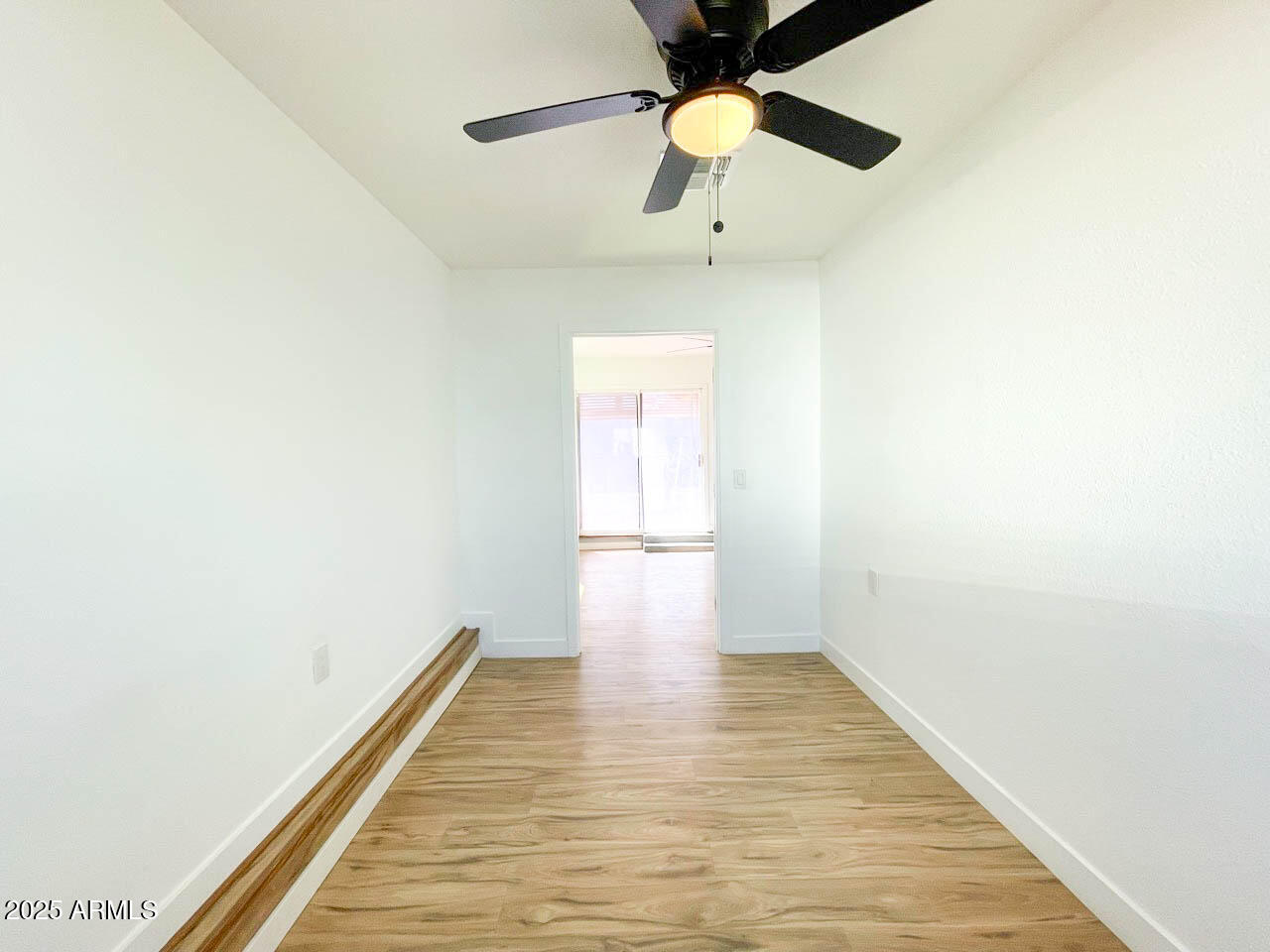 8125 East 5th Avenue Mesa, AZ 85208 - Photo 36 of 46 a view of an empty room with wooden floor