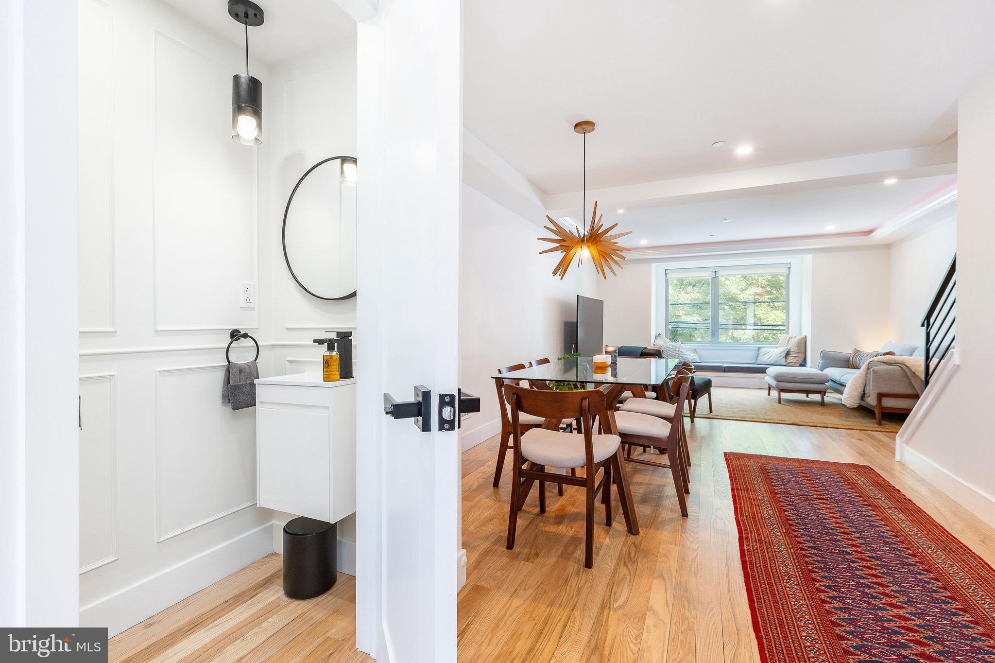 530 Reed Street Philadelphia, PA 19147 - Photo 14 of 57 a dining room with furniture a chandelier and wooden floor
