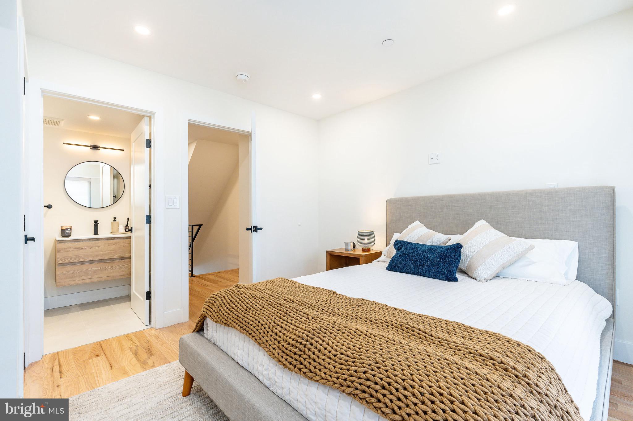 530 Reed Street Philadelphia, PA 19147 - Photo 19 of 57 a bedroom with a large bed and a couch