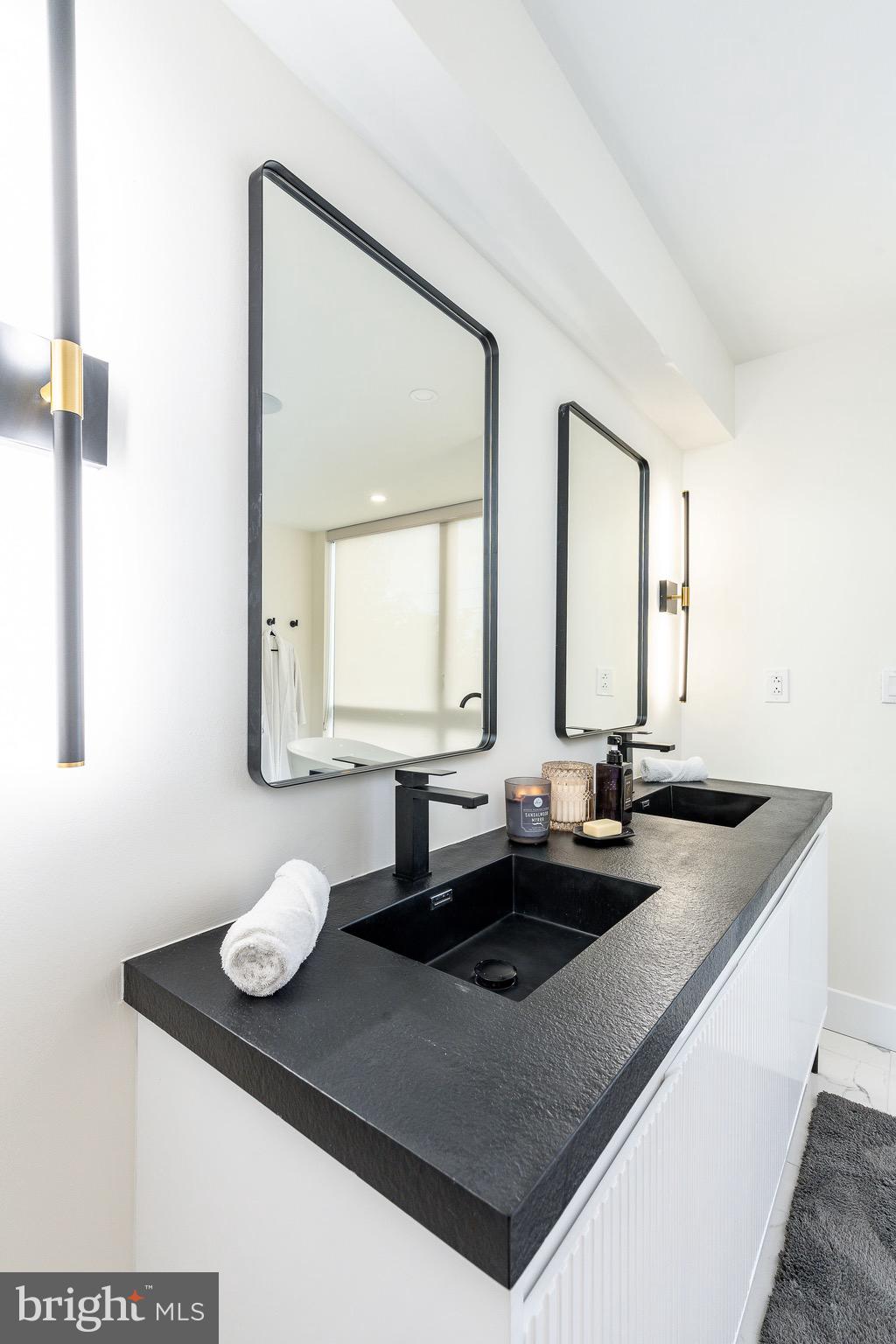 530 Reed Street Philadelphia, PA 19147 - Photo 36 of 57 a bathroom with a sink and a mirror