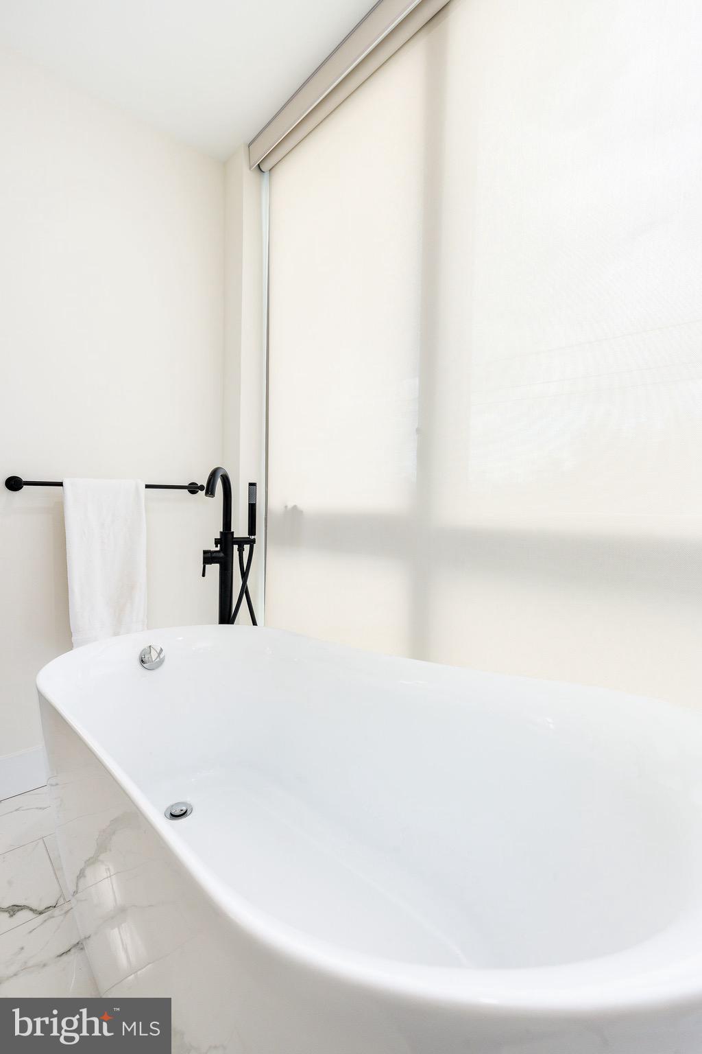530 Reed Street Philadelphia, PA 19147 - Photo 38 of 57 a white bath tub sitting in a bathroom