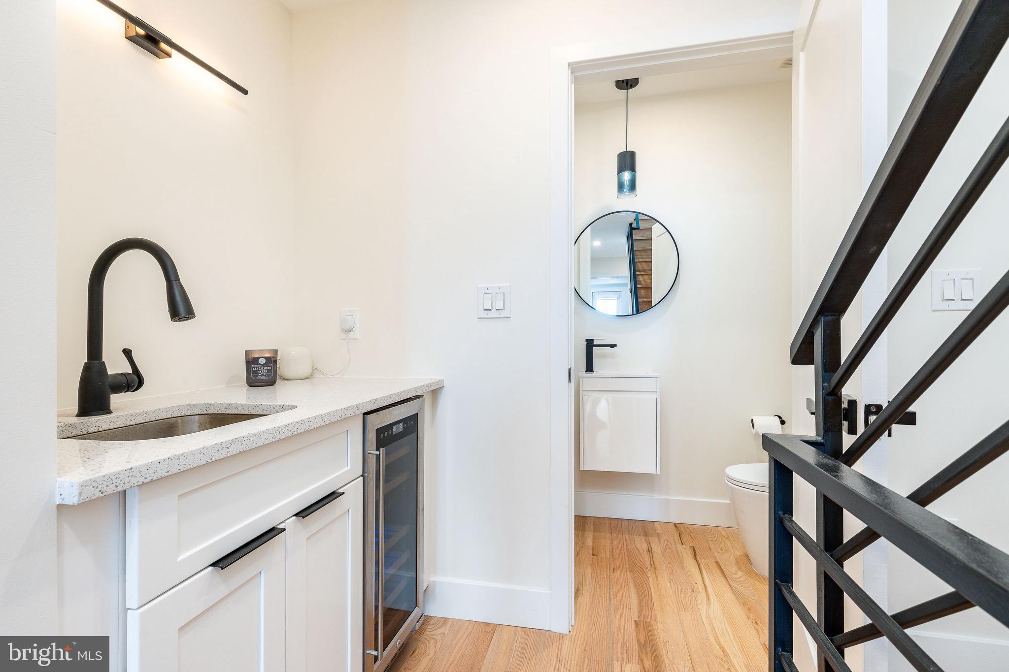 530 Reed Street Philadelphia, PA 19147 - Photo 41 of 57 a bathroom with a sink a toilet and a mirror