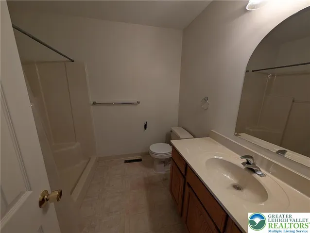 a bathroom with a sink toilet and tub