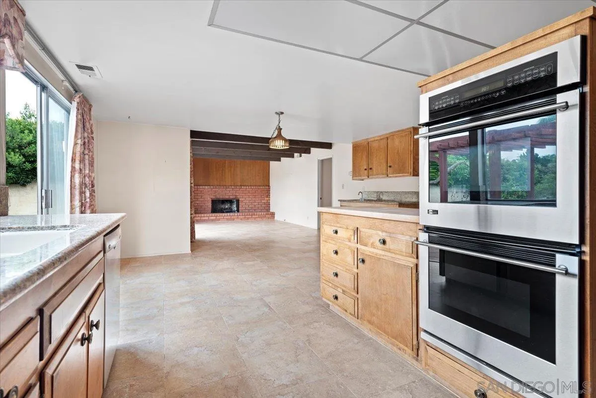2257 Villa Maria Road North Claremont, CA 91711 - Photo 15 of 44 a kitchen with stainless steel appliances white cabinets and a stove top oven