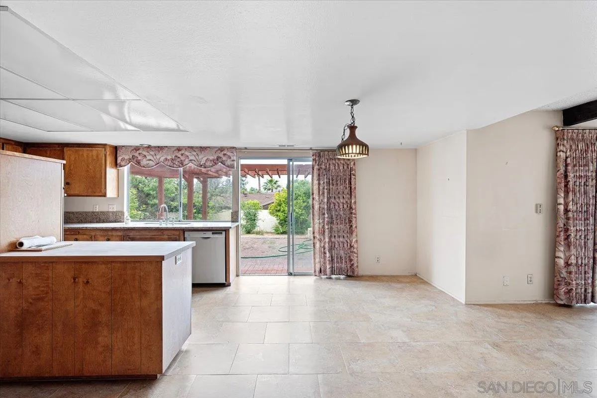 2257 Villa Maria Road North Claremont, CA 91711 - Photo 5 of 44 a view of a kitchen with a sink wooden cabinets and glass windows
