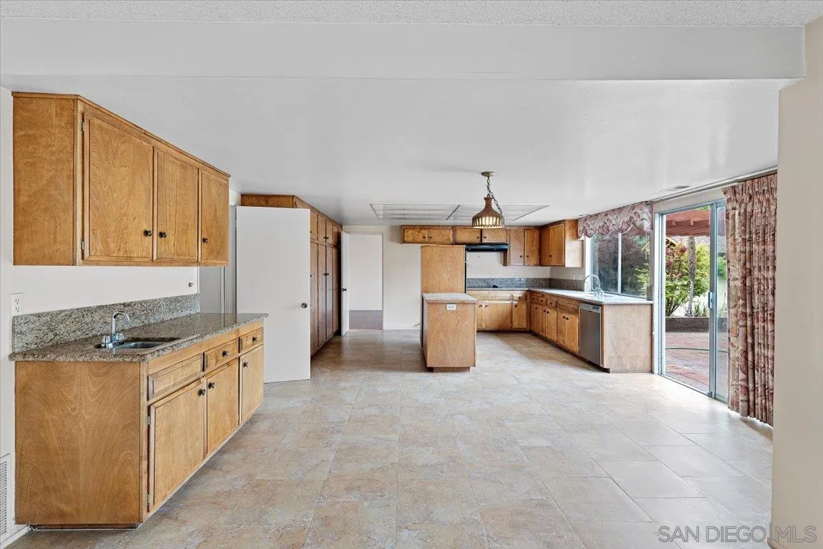 2257 Villa Maria Road North Claremont, CA 91711 - Photo 9 of 44 a kitchen with stainless steel appliances granite countertop a stove top oven a sink a refrigerator and white cabinets