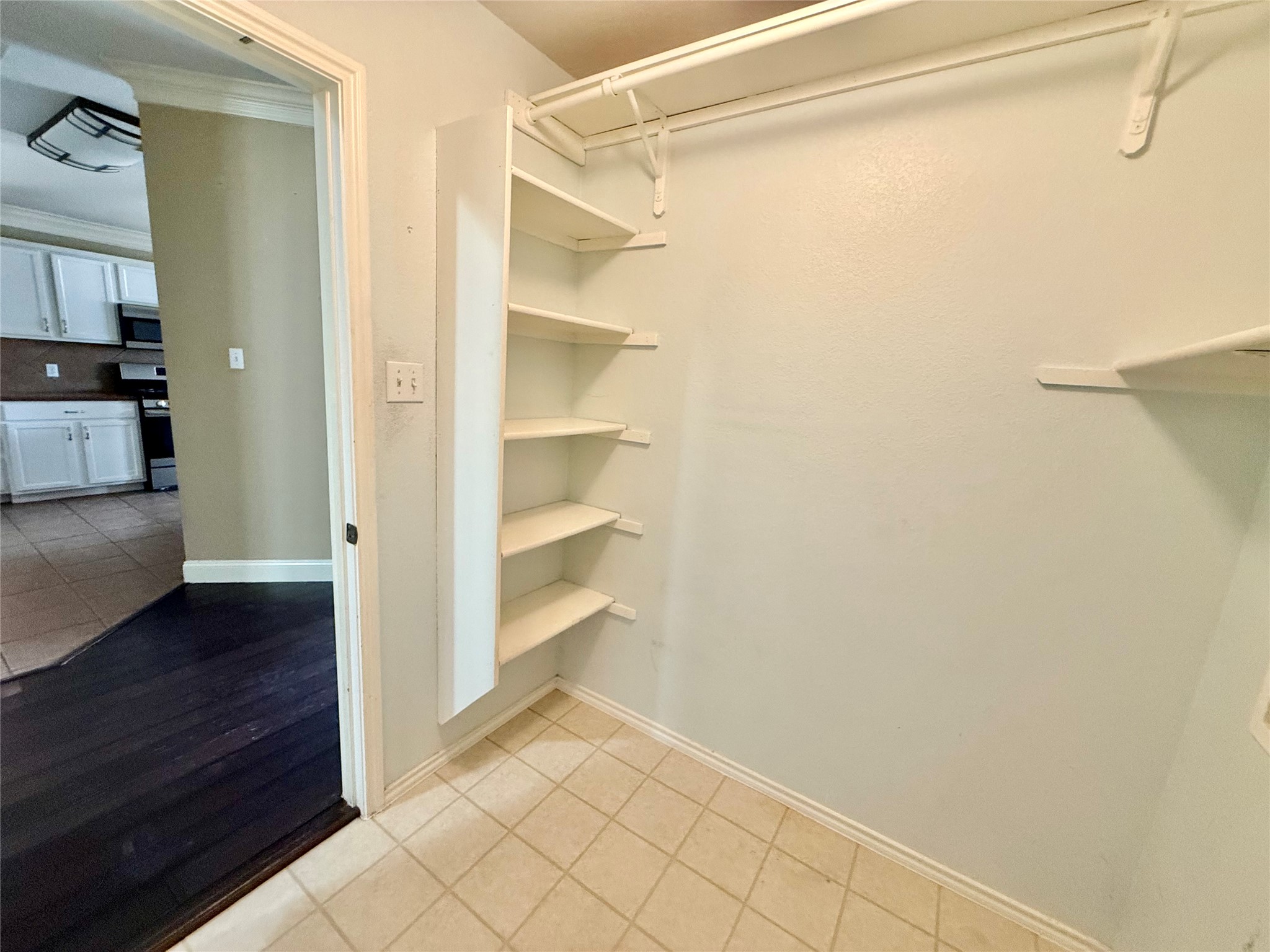 12820 Waynespur Lane Elgin, TX 78621 - Photo 14 of 26 a view of walk in closet with empty racks