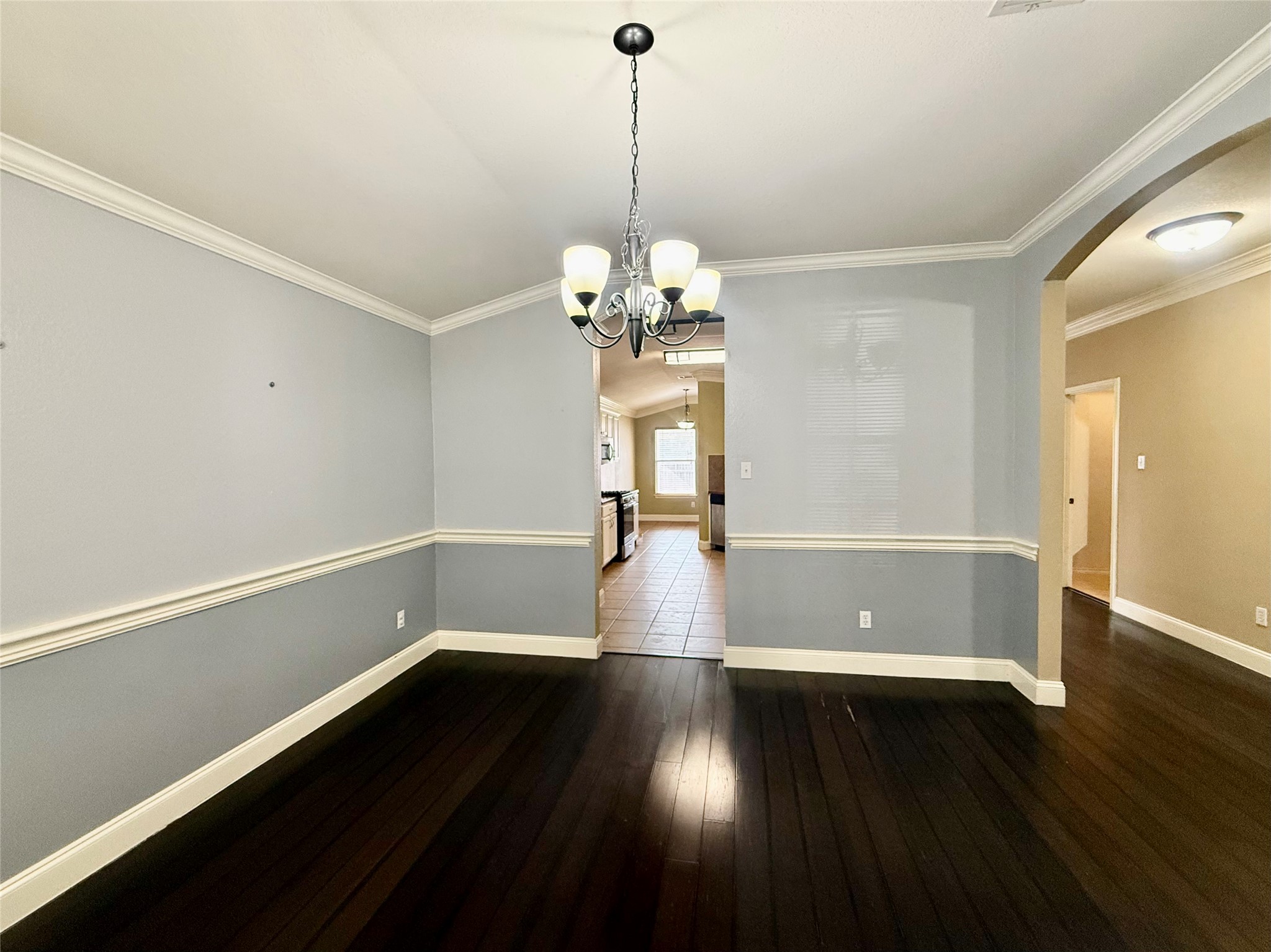 12820 Waynespur Lane Elgin, TX 78621 - Photo 4 of 26 a view of a room with wooden floor and large window