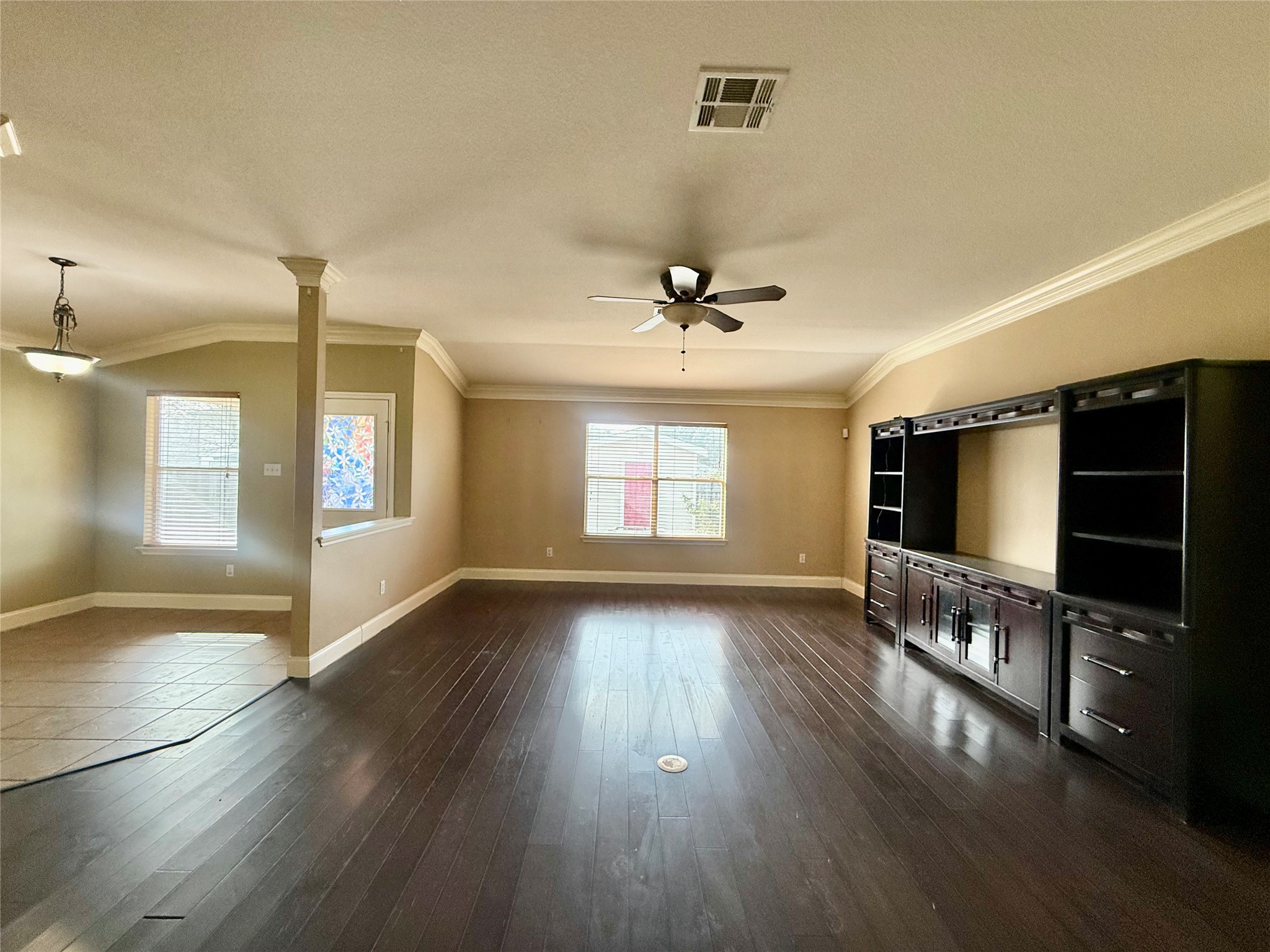 12820 Waynespur Lane Elgin, TX 78621 - Photo 6 of 26 a view of a livingroom with wooden floor and window