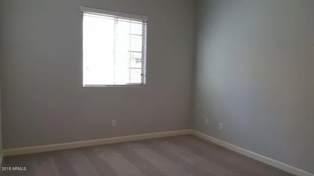 a bathroom with a sink and a window