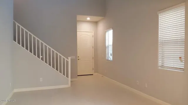 a view of a hallway with windows