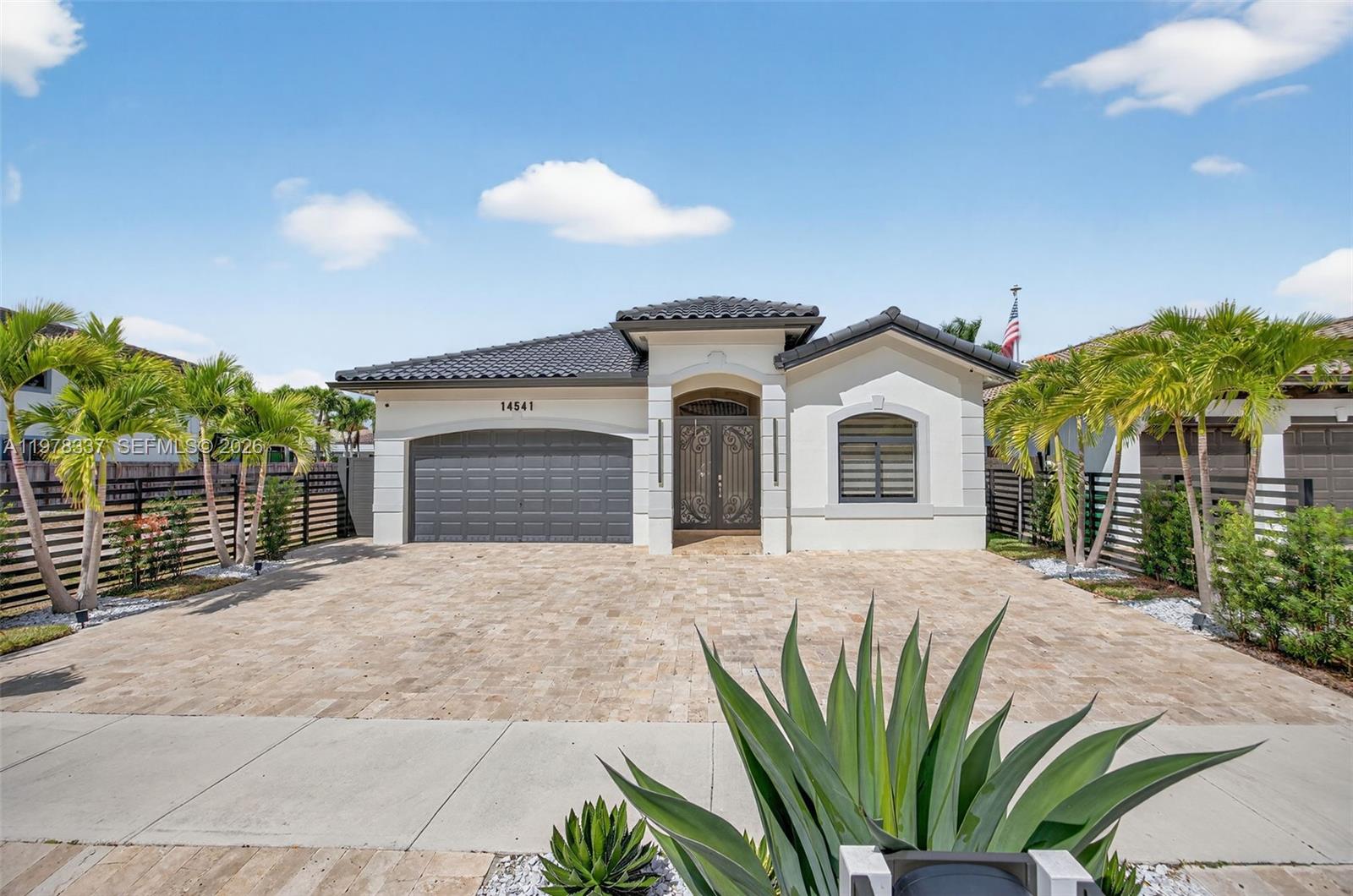 14541 Southwest 16th Street Miami, FL 33184 - Photo 1 of 51 a view of a house with a yard and potted plants