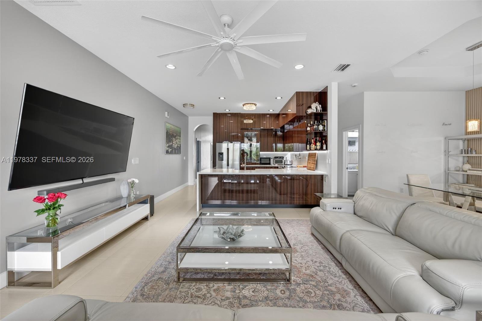 14541 Southwest 16th Street Miami, FL 33184 - Photo 8 of 51 a living room with furniture and a flat screen tv