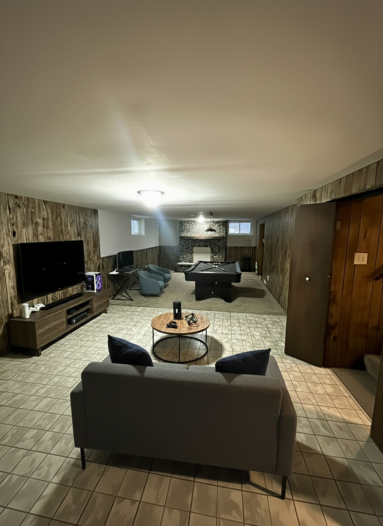 2843 193rd Street Lansing, IL 60438 - Photo 16 of 17 a living room with furniture and a flat screen tv