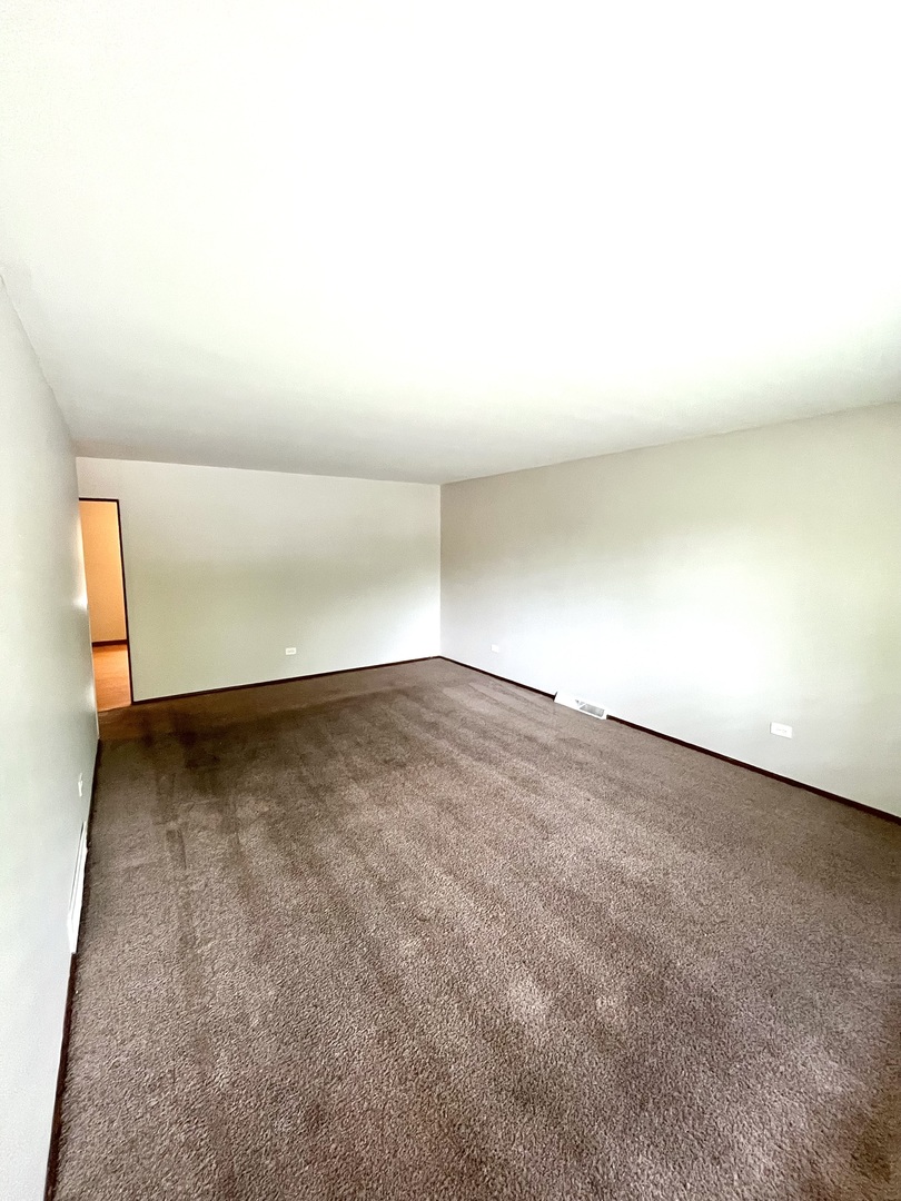 2843 193rd Street Lansing, IL 60438 - Photo 3 of 17 an empty room with a natural light