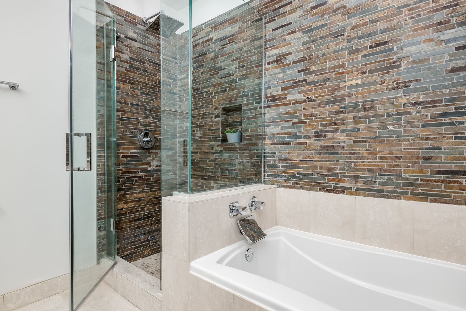 550 West Fulton Street, Unit 301 Chicago, IL 60661 - Photo 16 of 26 a bathroom with a bathtub and shower