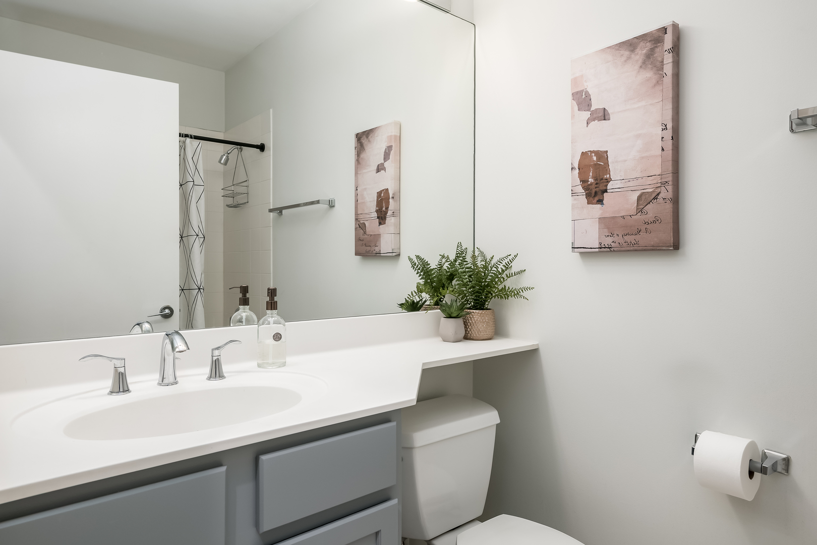 550 West Fulton Street, Unit 301 Chicago, IL 60661 - Photo 19 of 26 a bathroom with a sink a toilet and mirror