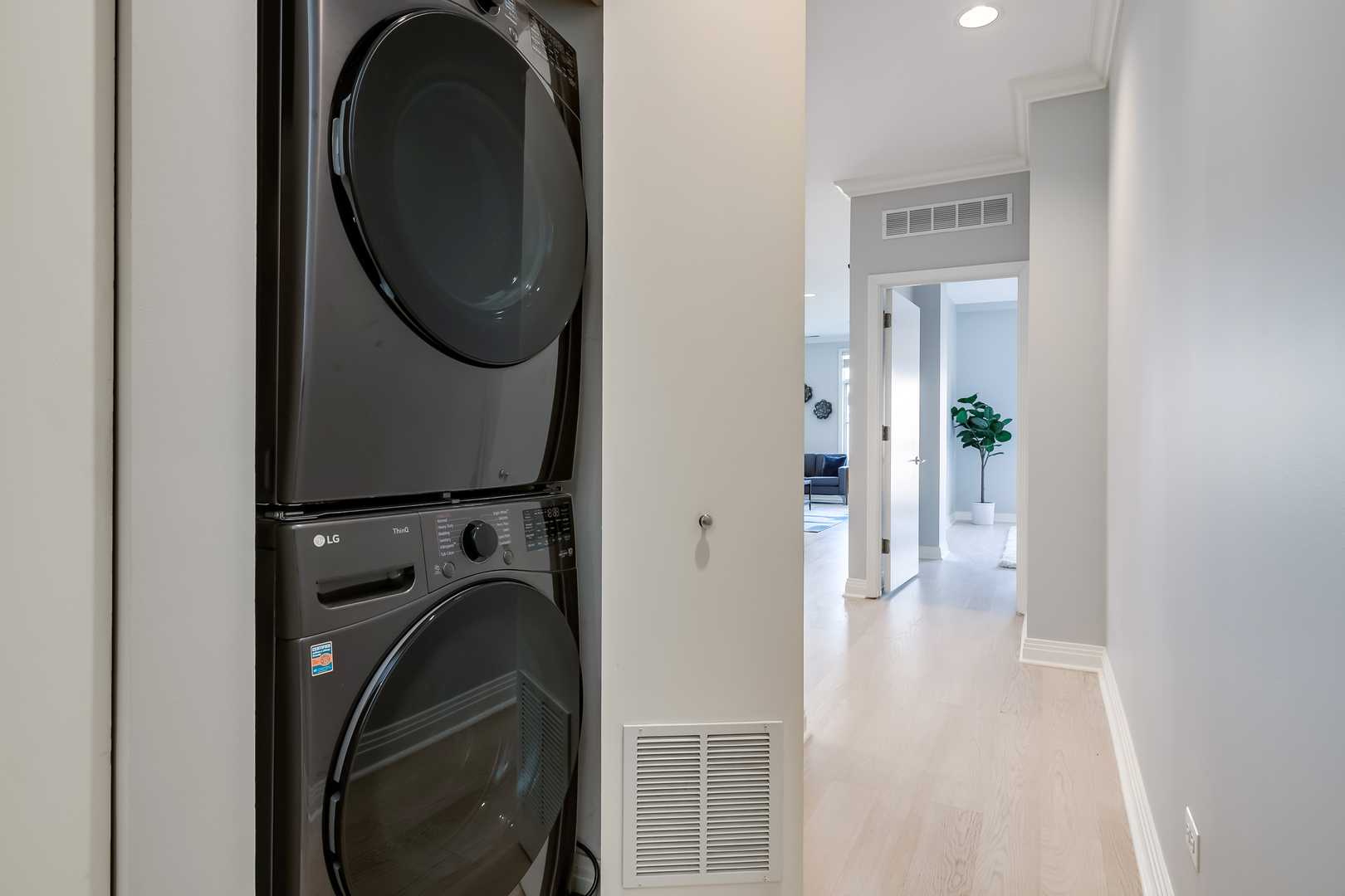 550 West Fulton Street, Unit 301 Chicago, IL 60661 - Photo 20 of 26 a view of a hallway with washer and dryer