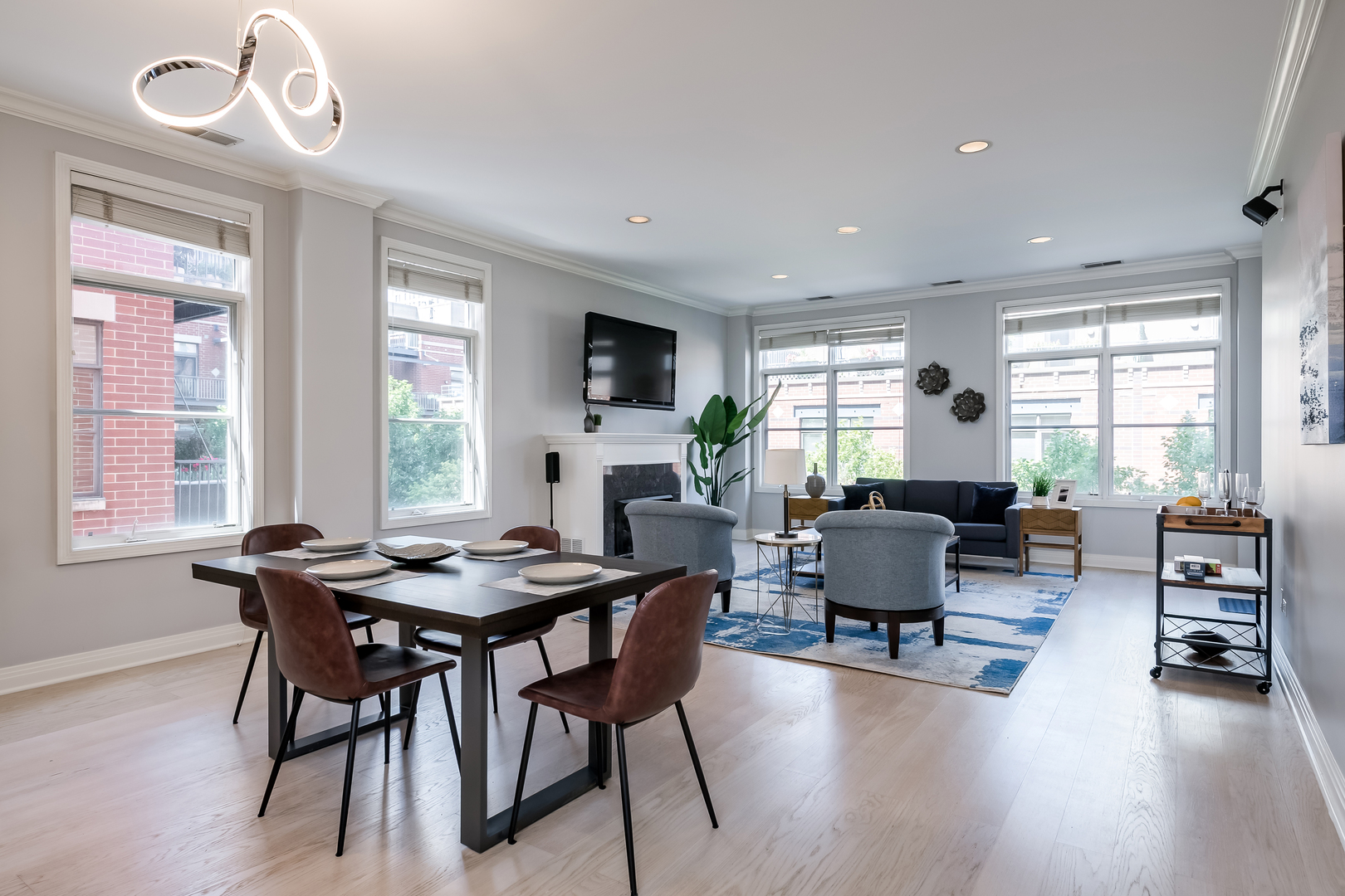 550 West Fulton Street, Unit 301 Chicago, IL 60661 - Photo 2 of 26 a view of a dining room with furniture window and wooden floor