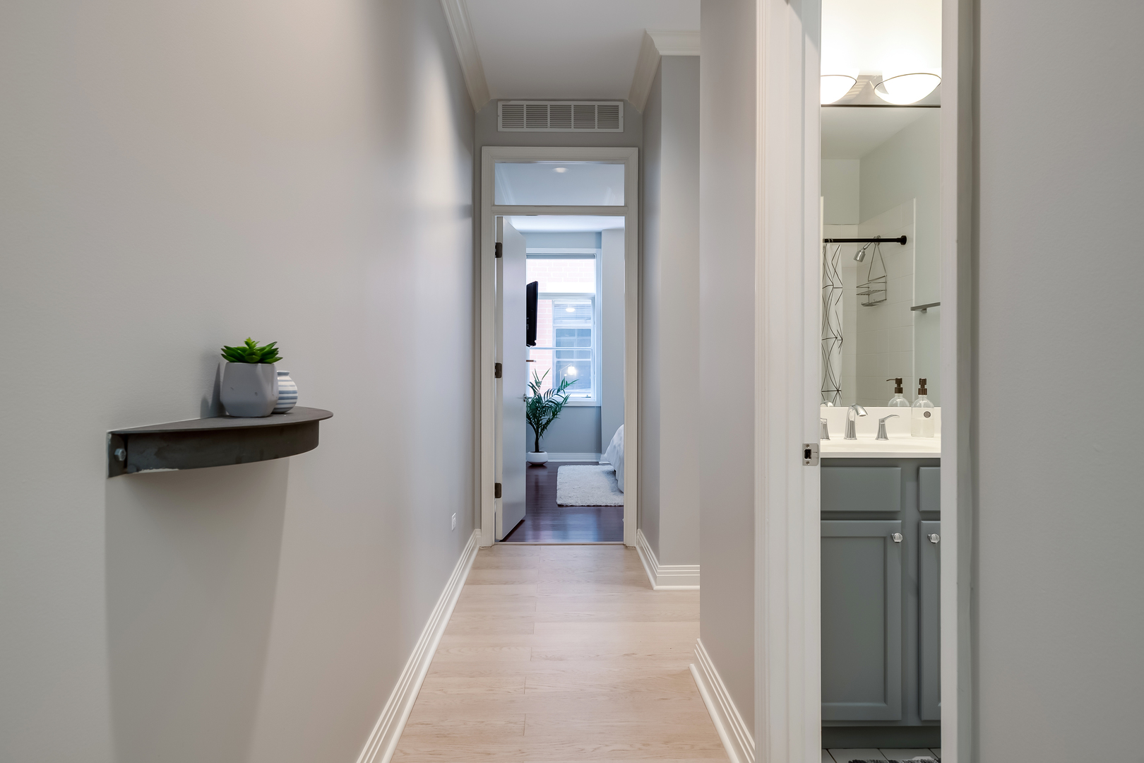 550 West Fulton Street, Unit 301 Chicago, IL 60661 - Photo 22 of 26 a view of a bathroom from a hallway