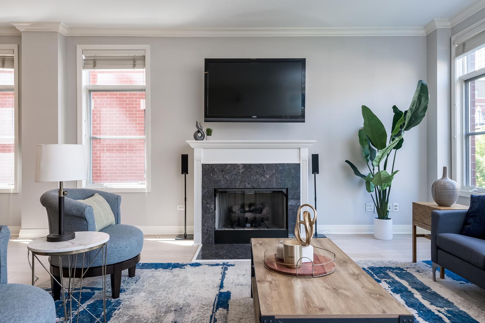550 West Fulton Street, Unit 301 Chicago, IL 60661 - Photo 7 of 26 a living room with furniture and a fireplace
