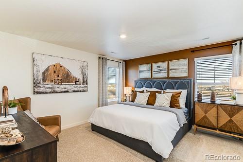 763 Ayrshire Road Johnstown, CO 80534 - Photo 17 of 31 a bedroom with a bed and painting on the wall
