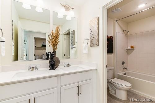 763 Ayrshire Road Johnstown, CO 80534 - Photo 24 of 31 a bathroom with a sink a toilet a mirror and shower