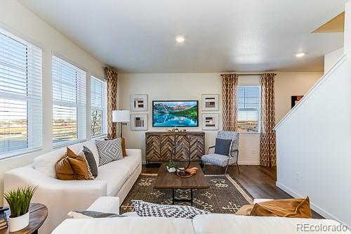 763 Ayrshire Road Johnstown, CO 80534 - Photo 7 of 31 a living room with furniture and a couch