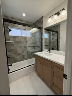 a bathroom with a sink and mirror