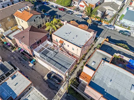 an aerial view of a building with a lot of trees