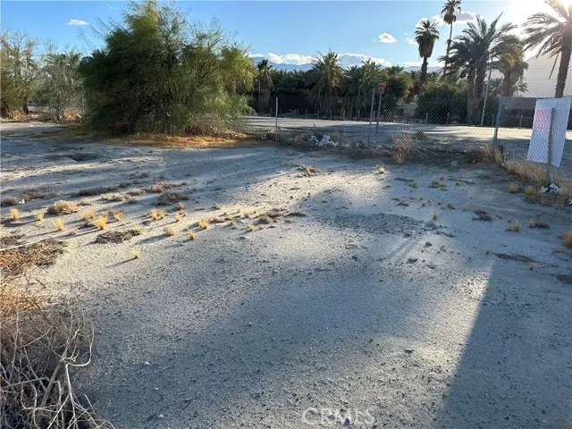 66038 Harrison Street Thermal, CA 92274 - Photo 2 of 10 a view of a dirt road with trees in the background