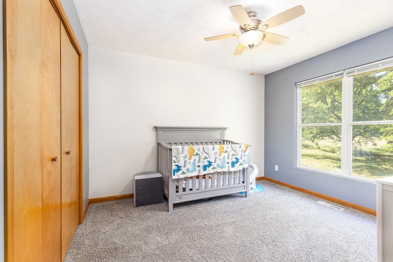1056 Lake Summerset Road Davis, IL 61019 - Photo 16 of 26 a living room with furniture and a window